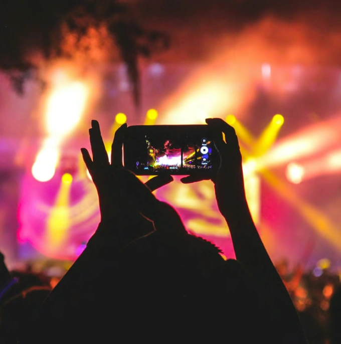 Evening entertainment event in Apex North Carolina with vibrant lighting and audience