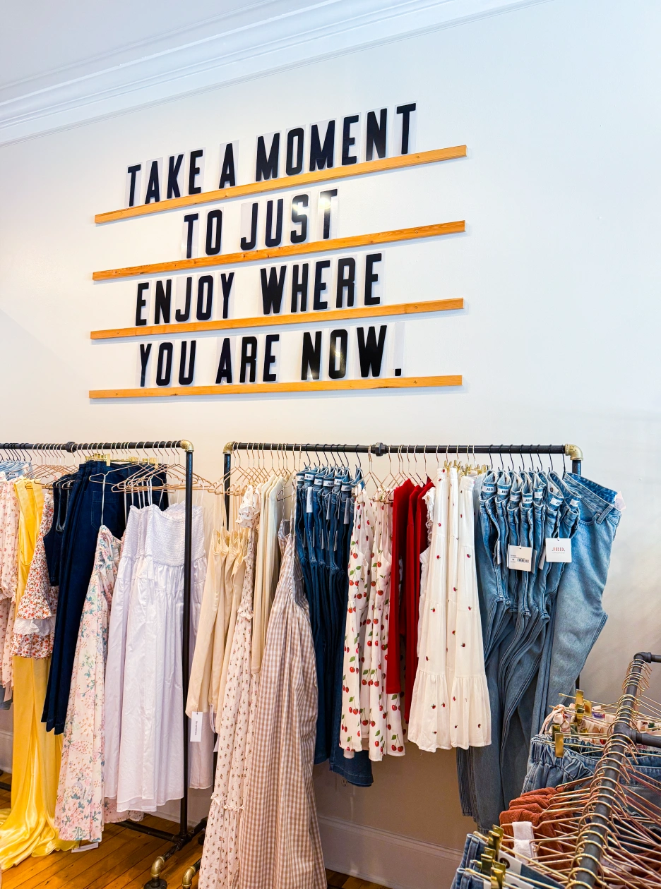 Stylish apparel and denim inside a women's fashion boutique