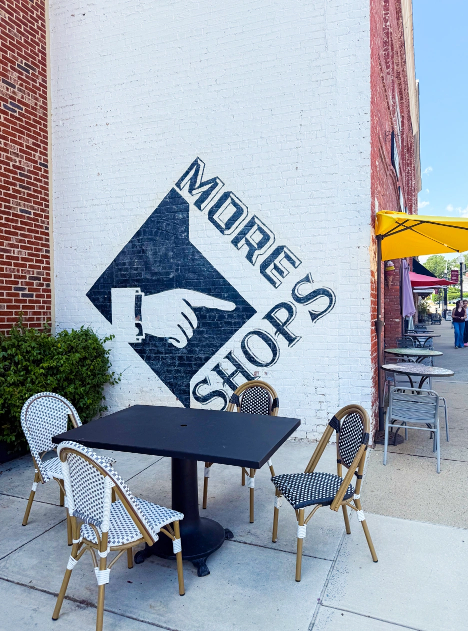 Downtown Apex streetscape featuring Moore Square mural and patio dining