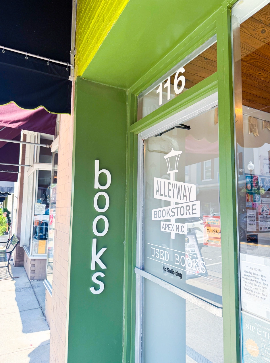 Green storefront of Alleyway Bookstore on Salem Street in Apex North Carolina