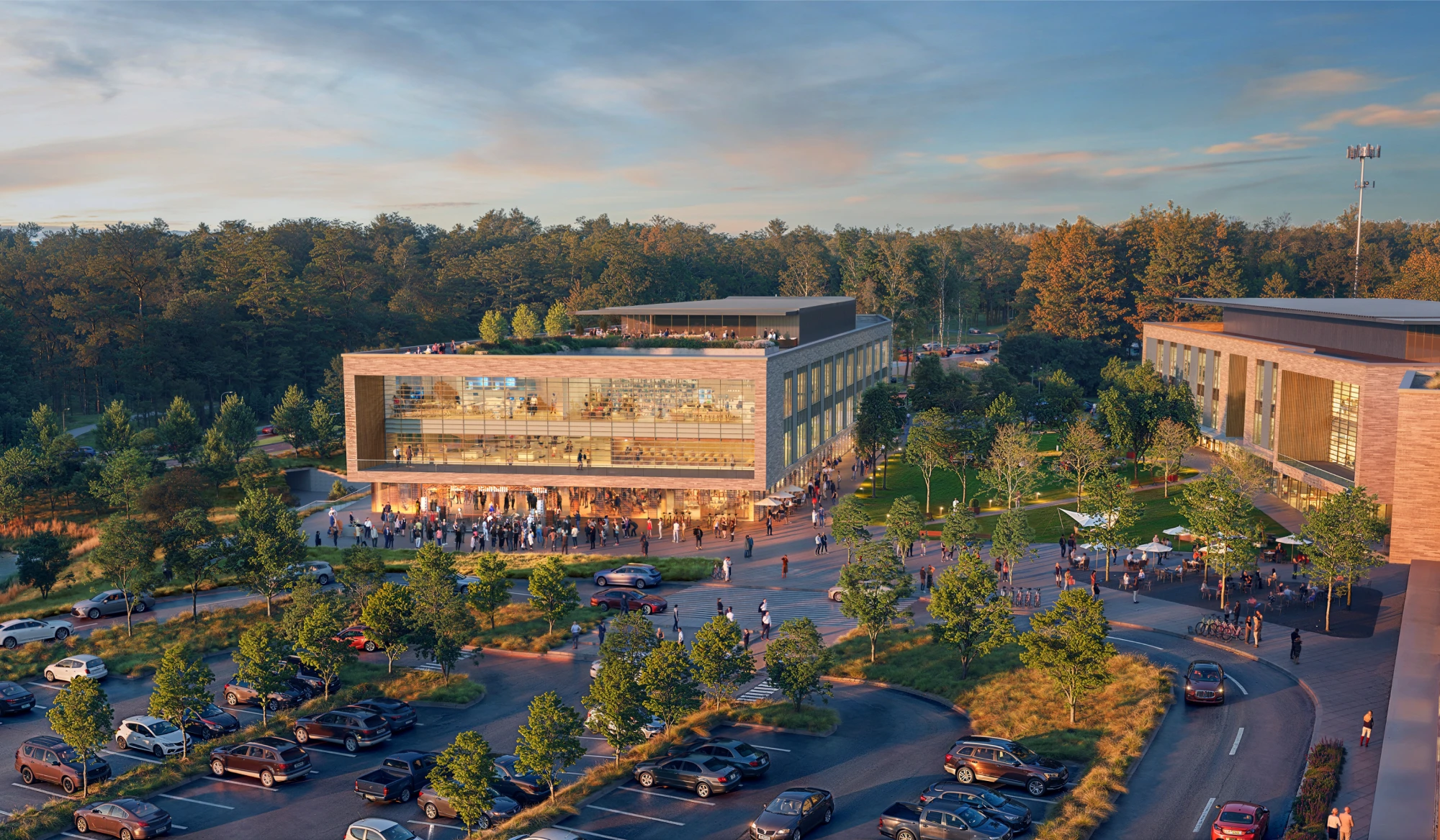 Vibrant community hub featuring retail office buildings rooftop terrace and busy pedestrian plaza with parking areas