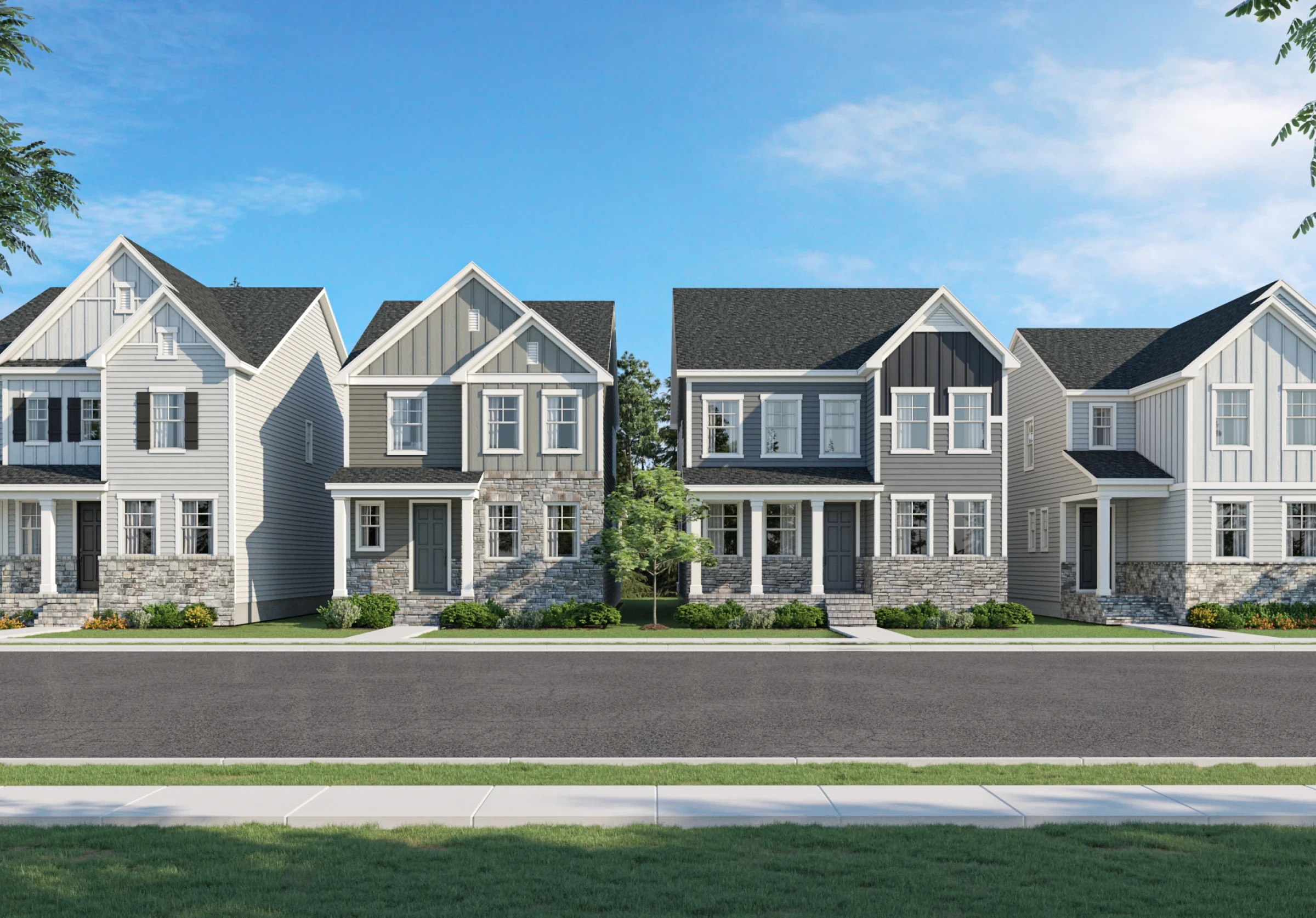 Newly built single family homes with symmetrical facades driveways and quiet residential street setting