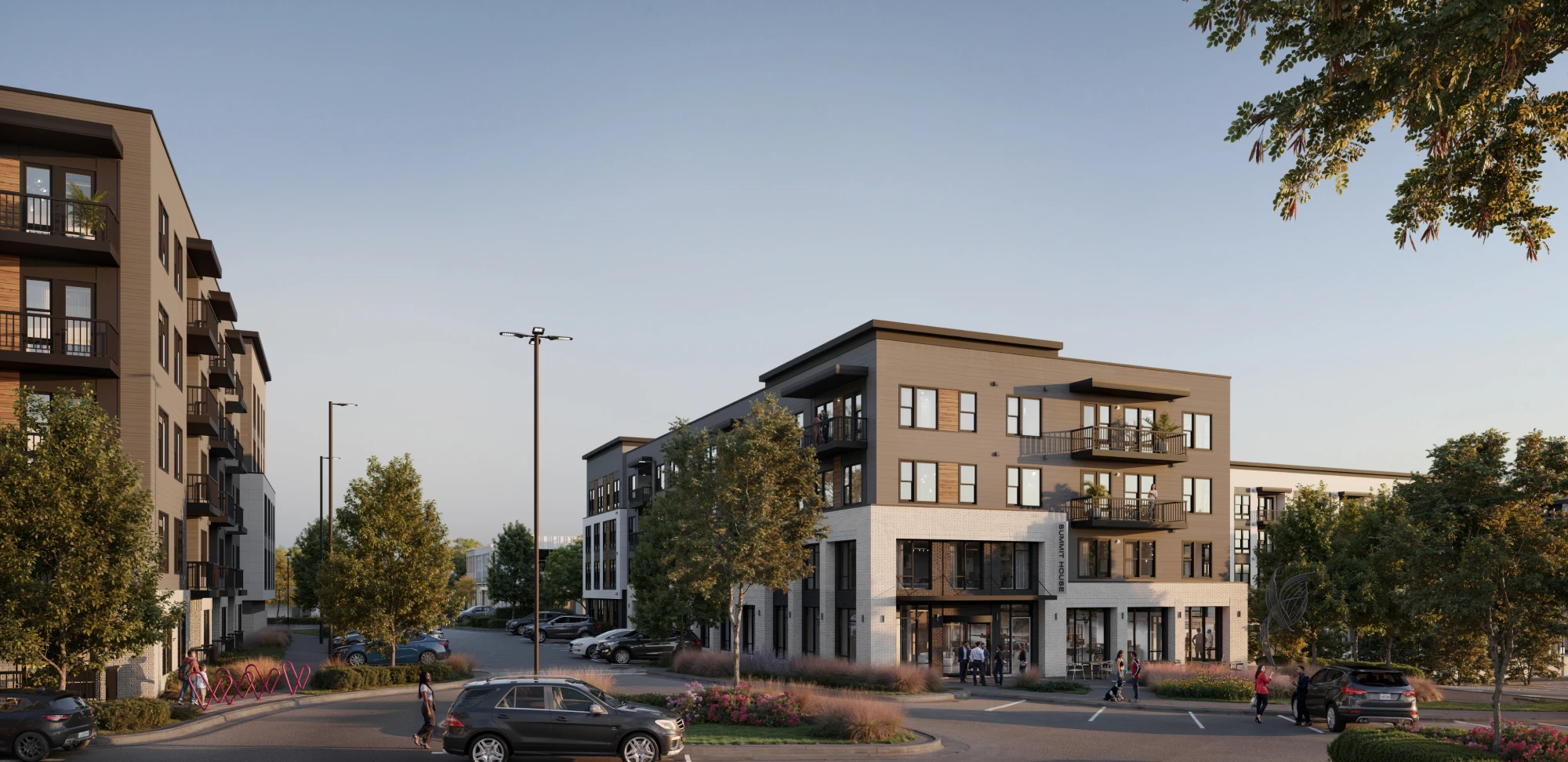 Contemporary residential complex featuring balconies mixed use space and tree lined streets with parked cars
