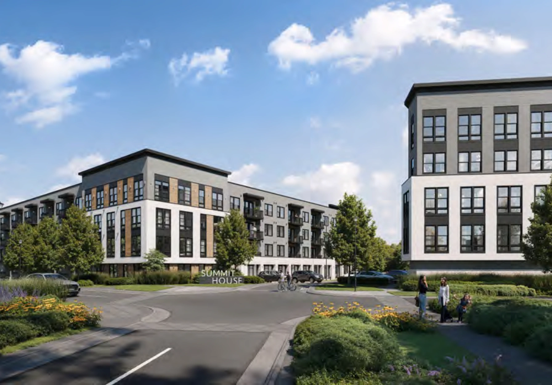 Modern apartment complex with landscaped grounds wide sidewalks and contemporary multi story residential buildings